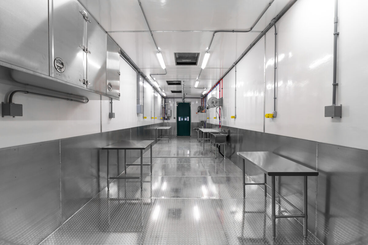 Stainless steel tables and cabinets in a Friesla Cut and Wrap Module.