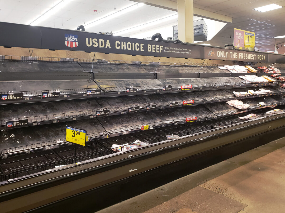 An empty shelf labeled for USDA Choice Beef at a grocery store during COVID-19.