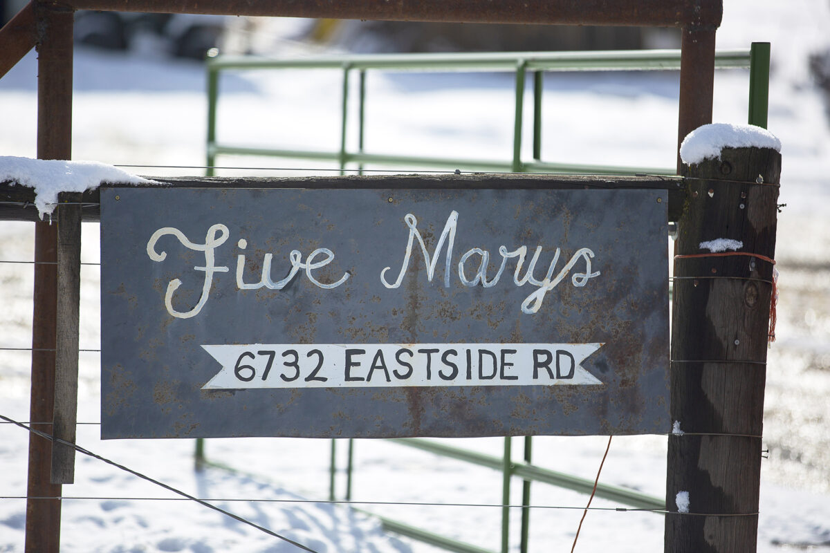 Five Marys steel sign on a fence in the snow on their ranch in Fort Jones, California.