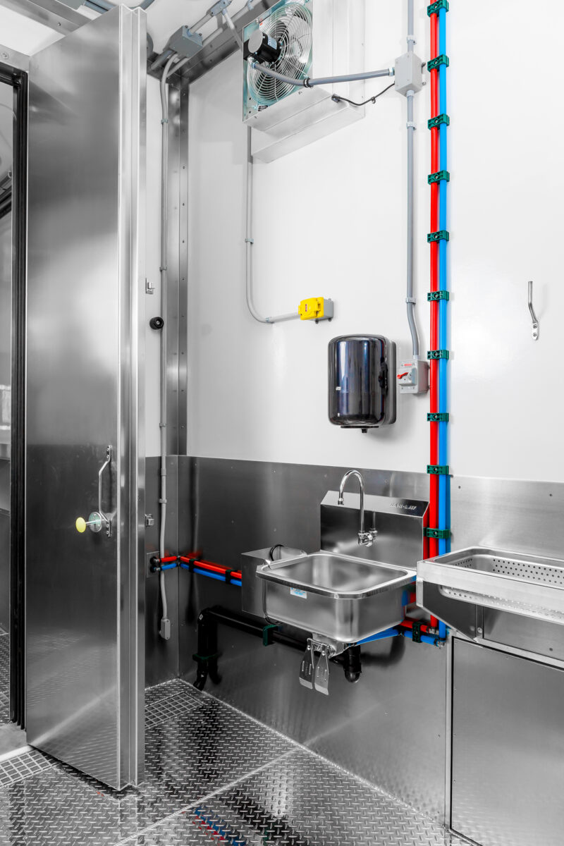 Stainless steel hands-free washing station in Friesla Modular Abattoir System.